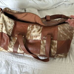 Cowhide duffle bag